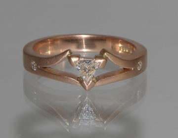 Bespoke engagement ring with trilliant cut diamond and matte finish