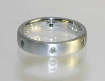 Bespoke eternity ring with heat-treated-black and white diamonds.