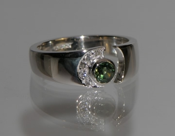 Bespoke green sapphire and diamond engagement ring