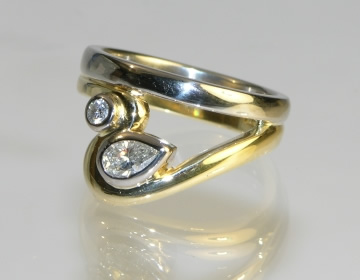 Bespoke white and yellow gold sculptural engagment ring