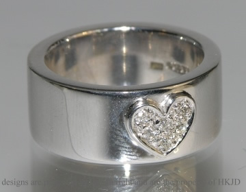 9ct white gold engagement ring with six grain set 1.5mm diamonds in a heart shape