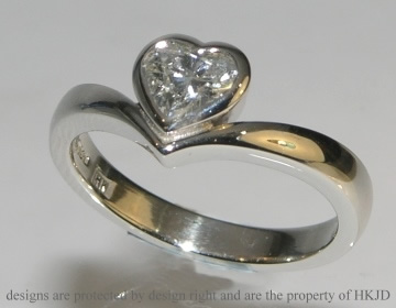 Platinum engagement ring with 0.60cts HSI heart shaped diamond 