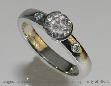 Bespoke platinum engagement ring with 0.66cts H SI 1/VS2 brilliant cut diamond.