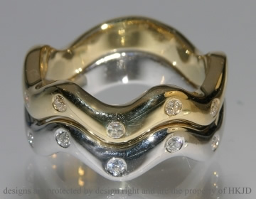 18ct yellow and white gold pair of rings with 12 H SI 2mm diamonds