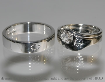 Pair of commissioned 9ct white gold wedding bands with engraved detail.