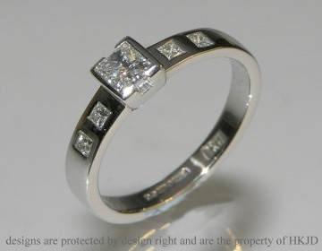 Platinum engagement ring with 5 princess cut diamonds