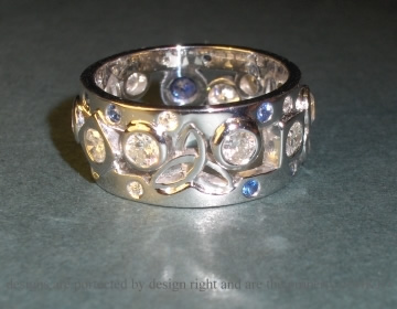 9ct white gold wedding ring with sapphires and diamonds.