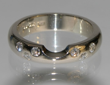 Fitted eternity ring with zig-zag invisibly set diamonds