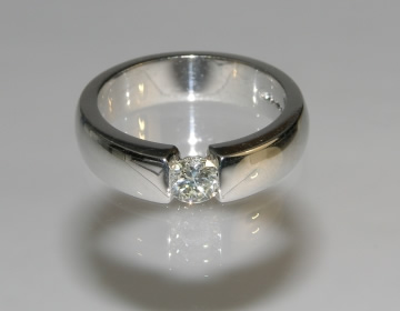 Bespoke engagement ring made to look as though it is tension set