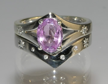 Bespoke pink sapphire and diamond engagement ring and fitted wedding ring