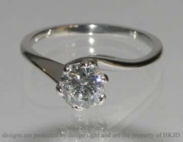 Bespoke platinum engagement ring incorporating customers own diamond. 