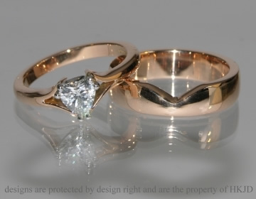 Commissioned rose gold fitted cut out style wedding ring