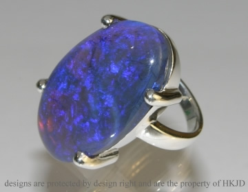 Bespoke silver dress ring incorporating customers own oval 29.84ct opal.