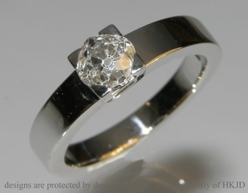 Bespoke platinum engagement ring incorporating customers own 0.97cut diamond. 