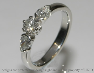 Platinum commissioned engagement ring with 3 diamonds 