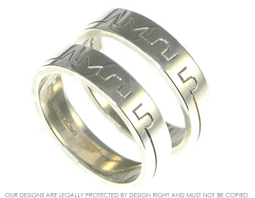 Pair of Sterling silver unique commitment rings engraved with 'amour'