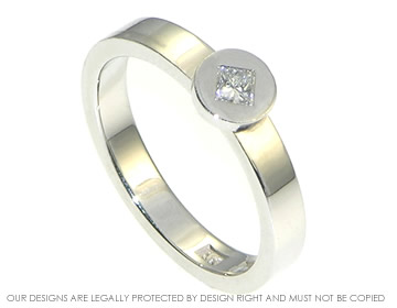 Modern geometric diamond solitaire engagement ring in Platinum