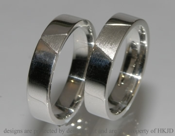 Mens platinum wedding bands with a simple engraved line detail. 