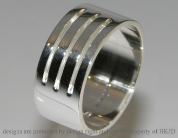 Silver polished  contemporary architecture inspired mans ring.