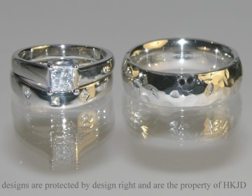 A Pair of platinum and diamond commissioned wedding bands. 