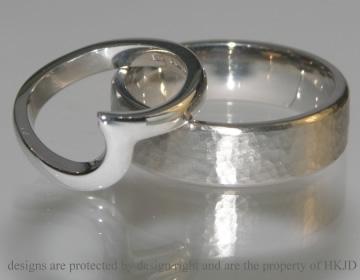 A Pair of white gold commissioned wedding bands 