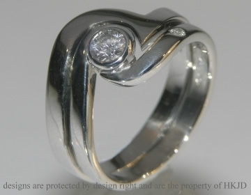 Platinum commissioned swirly wedding band