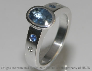 18ct white gold engagement ring with an oval cut 0.98ct sapphire