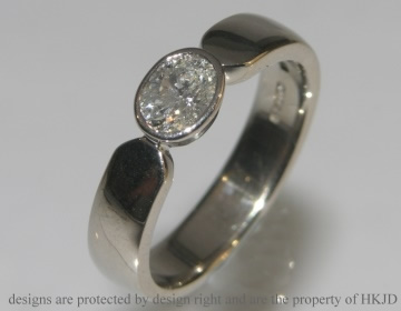 18ct white gold all around set oval 0.59ct diamond solitaire