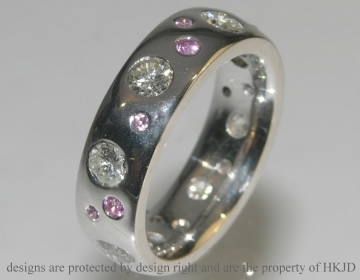 9ct white gold ring with customers own diamonds.