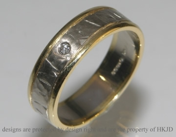 Commissioned 18ct white and yellow gold textured wedding band.