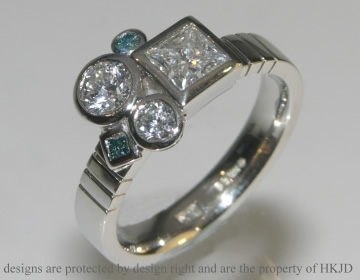 Artist inspired platinum engagement ring with white and heat-treated diamonds.   