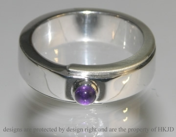 Commissioned 9ct white gold and amethyst eternity ring