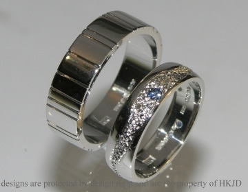 Pair of commissioned platinum wedding rings with a grained texture