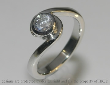 Platinum commissioned engagement twist ring with a 0.44ct GVS1 brilliant cut diamond 