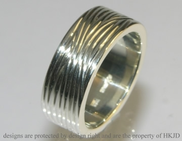 9ct white gold commissioned ring with a thread like finish.