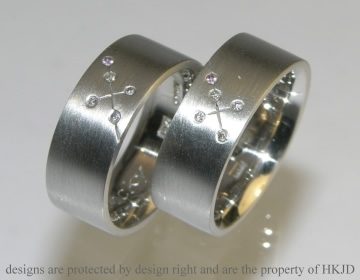 Two bespoke heavy platinum, diamond and pink sapphire Commitment rings