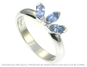 Delicate 9ct white gold and sapphire engagament ring inspired by tulip petals.