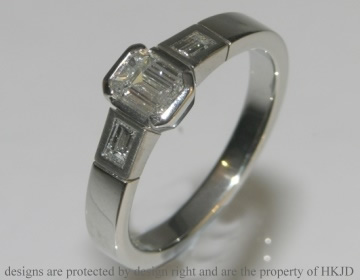 Platinum Art Deco inspired emerald cut diamond engagement ring