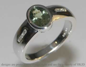 Natural green sapphire and diamond engagement ring