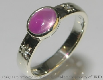 Bespoke star sapphire engagemnet ring with shoulder diamonds