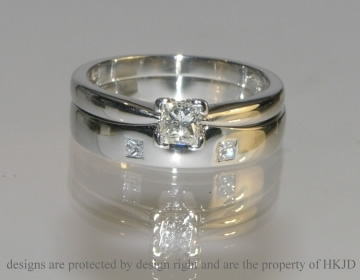 Commissioned platinum and diamond engagement ring with a fitted wedding band.