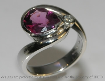 Platinum dress ring incorporating customers own pear shape plum tormaline and brilliant cut diamond. 