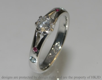 Platinum, ruby and Aquamarine engagement ring with 4.5mm brilliant cut 4.5mm H SI diamond 