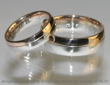 Pair of platinum and 18ct rose gold wedding bands. 