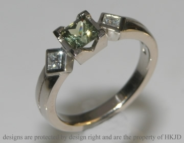 18ct white gold, green sapphire and diamond engagement ring.