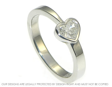 Platinum heart shaped diamond solitaire engagement ring