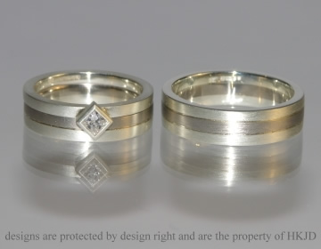 Contrasting white gold commissioned engagement ring and wedding bands