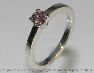 Delicate platinum engagement ring with beautiful 0.26cts heat-treated pink diamond