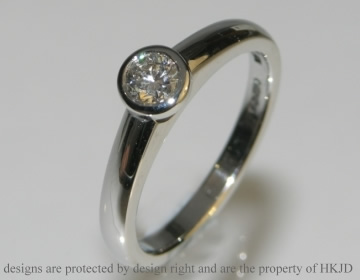 Platinum open tip solitare with a 0.31ct brilliant cut diamond. 