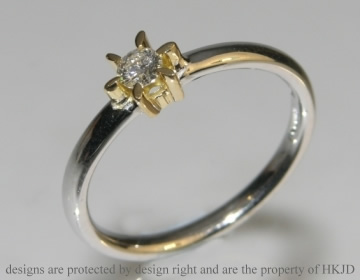 Daisy inspired white and yellow gold diamond solitaire engagement ring